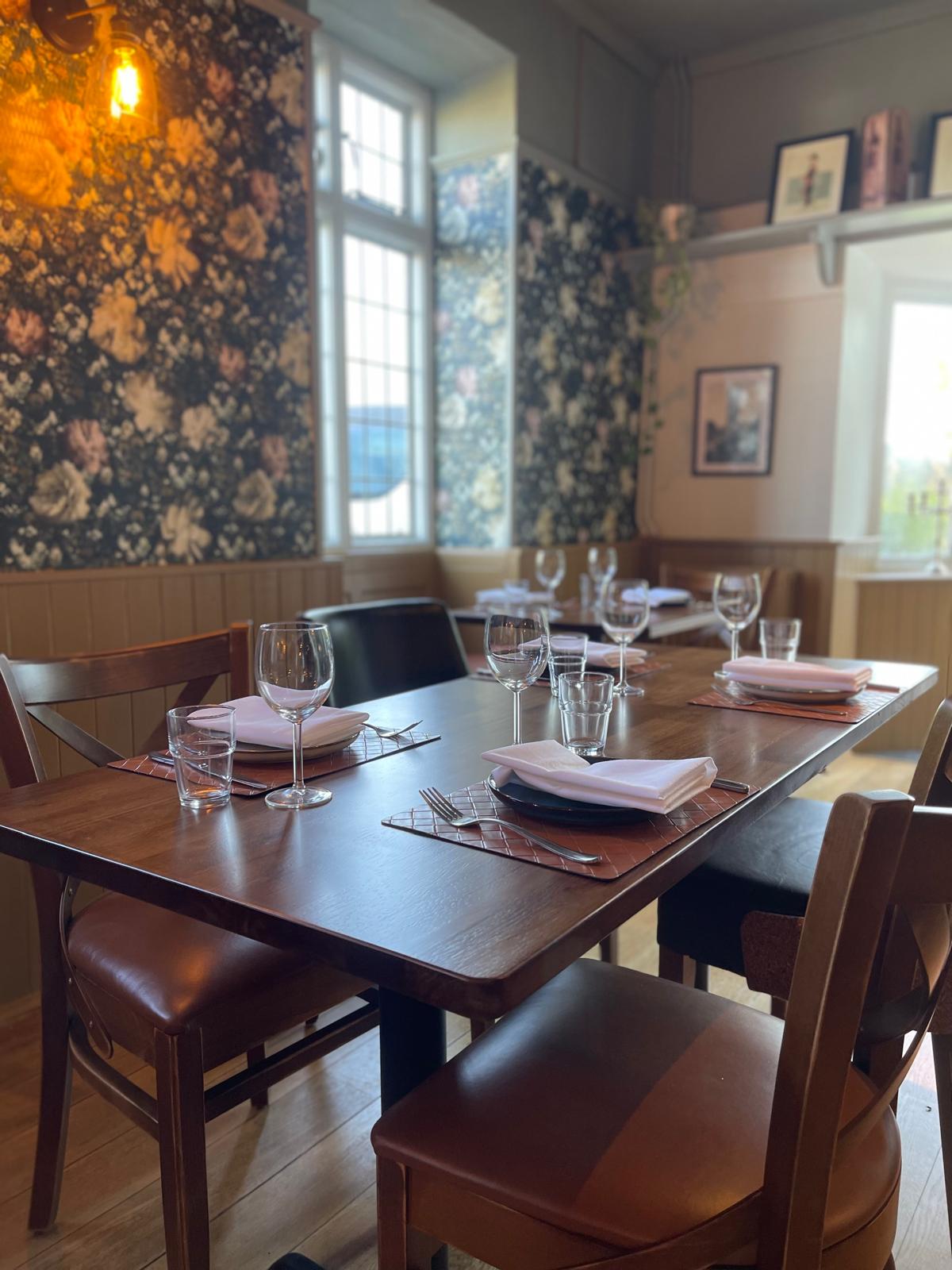 A table set for dining inside The Royal Sun